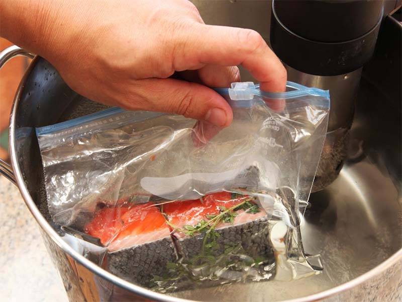 Put the food bag into the sous vide cooker after conducting vacuum